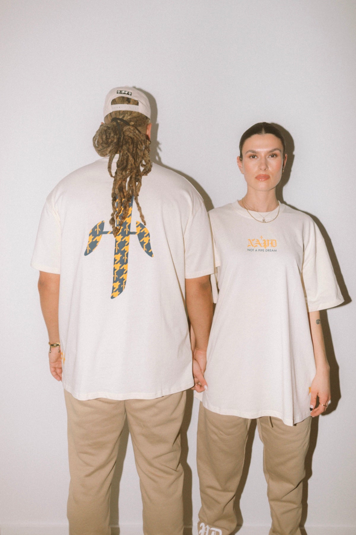 Man and Woman in NAPD Not A Pipe Dream T-Shirt